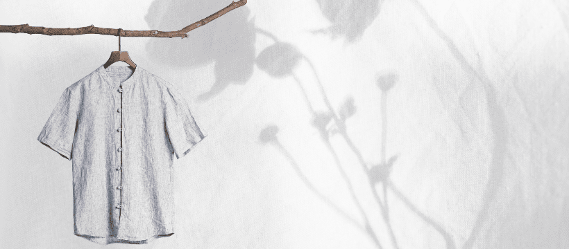 Freshly pressed shirt hanging neatly, representing professional ironing and garment care.